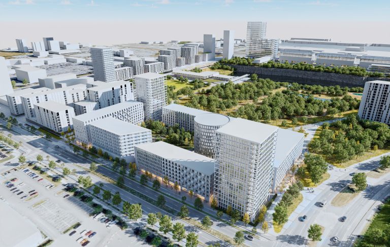 En avant-plan, en bordure du boulevard Daniel-Johnson, angle Du Souvenir, se déploie le projet résidentiel du Carré Laval confié au Groupe Angus. À terme, il comprendra 8 bâtiments, dont la hauteur variera entre 7 et 18 étages, et plus de 1000 logements abordables hors marché locatif.